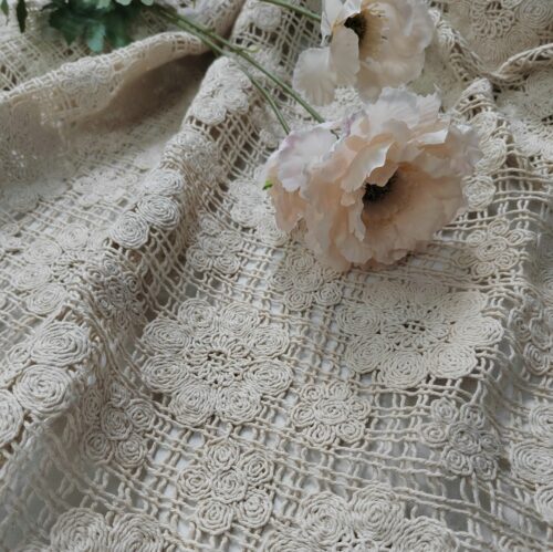 Embroidered fabric with spiral floral designs