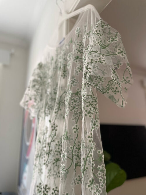 Delicate tulle embroidered with tiny blossoms