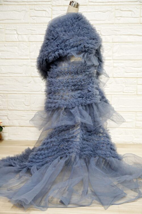 Plush fuzzy knit paired with sheer ruffled tulle layers