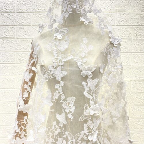 A delicate tulle cape adorned with floating butterfly appliqués A delicate tulle cape adorned with floating butterfly appliqués A delicate tulle cape adorned with floating butterfly appliqués