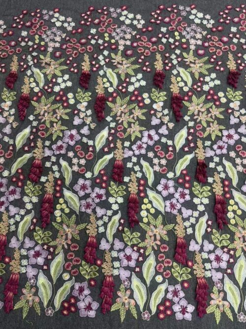 Dense floral and berry embroidered textile