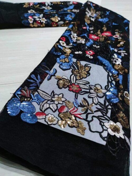 Embroidered lace fabric with floral motifs