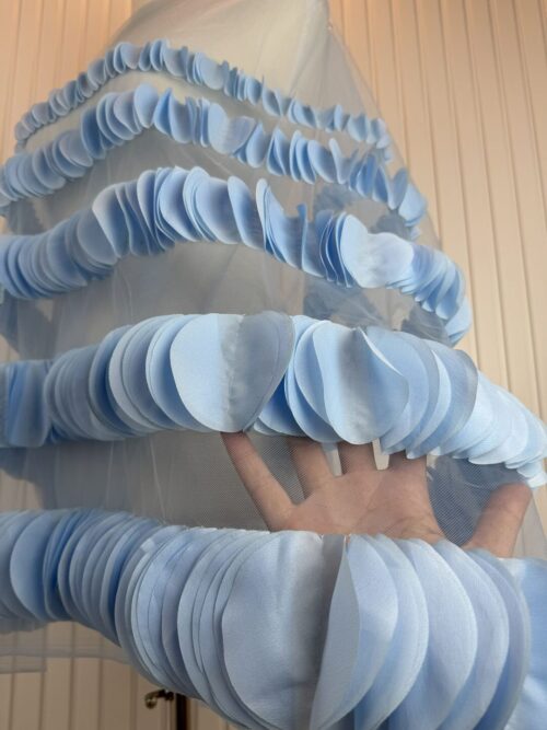 Delicate white tulle layered ruffle details